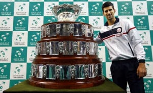 Serbia's Novak Djokovic poses with the Davis Cup trophy, post draw, before their tie against the might Czech Republic in 2013. Photo Credits : AFP