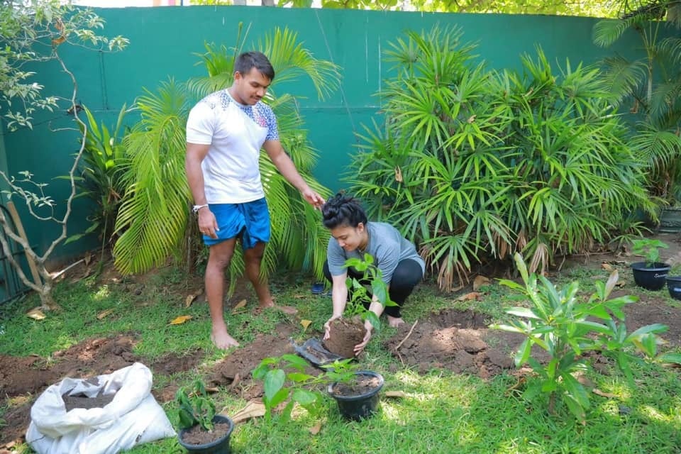 Former National Skipper Namal Rajapakse planting a plant with his wife.