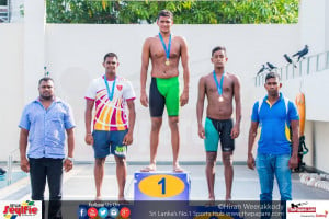 Figure SEQ Figure * ARABIC 1Dilanka Shehan receiving his medal for the 800m Freestyle (M). Left is Manula Coorya (silver) and right Amrith Perera (bronze)