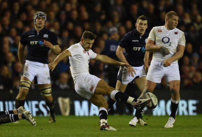 England's scrum half Danny Care kicks past England's captain and hooker Dylan Hartley (R) during the Six Nations international rugby union match between Scotland and England at Murrayfield in Edinburgh, Scotland on Febuary 6, 2016.