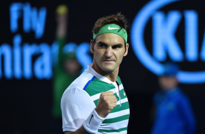 Switzerland's Roger Federer celebrates a point during his men's singles semi-final match against Serbia's Novak Djokovic on day eleven of the 2016 Australian Open tennis tournament in Melbourne on January 28, 2016. AFP PHOTO / SAEED KHAN-- IMAGE RESTRICTED TO EDITORIAL USE - STRICTLY NO COMMERCIAL USE / AFP / SAEED KHAN