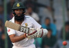 Gritty South Africa defy India in fourth Test South Africa's captain Hashim Amla looks at the ball after playing a shot during the fourth day of the fourth Test cricket match between India and South Africa ©AFP