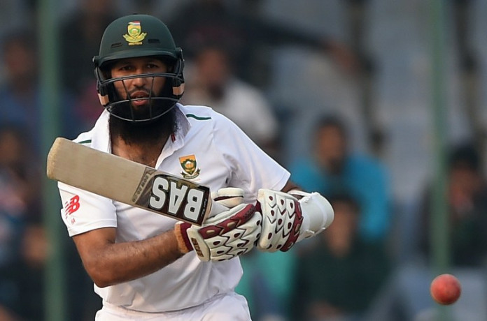 South Africa's captain Hashim Amla looks at the ball after playing a shot during the fourth day of the fourth Test cricket match between India and South Africa ©AFP