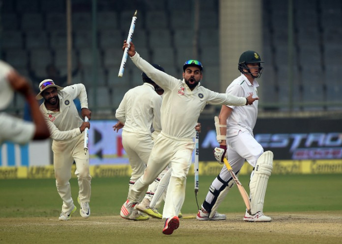 India's captain Virat Kohli (C) celebrates after winning the fourth Test