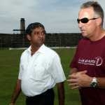 Former England cricketer Ian Botham (R) walks with stadium curator Jayananda Warnaweera at the Galle International Cricket Stadium in Galle, 20 April 2005. The stadium was submerged by the 26 December 2004 tsunamis and is not yet suitable for international matches. Botham is on a fact-finding mission to help tsunami victims and rebuild ravaged areas. AFP PHOTO/Sena VIDANAGAMA / AFP / SENA VIDANAGAMA