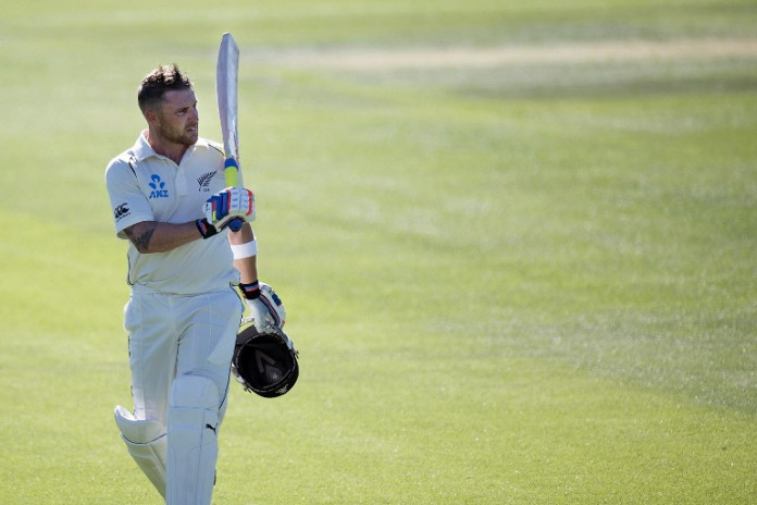 (FILES) A file photo taken on December 26, 2014 shows New Zealand's cricket captain Brendon McCullum waving to the fans during the cricket Test match between New Zealand and Sri Lanka