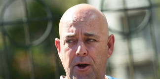 Australian cricket coach Darren Lehmann speaks to journalists in Melbourne on December 30, 2015, after Australia defeated the West Indies in the second Test match in four days. Lehmann said Australia were still weighing up selection options ahead of the final Test starting Sunday in Sydney, with bowler Peter Siddle notably carrying an ankle injury. / AFP / WILLIAM WEST