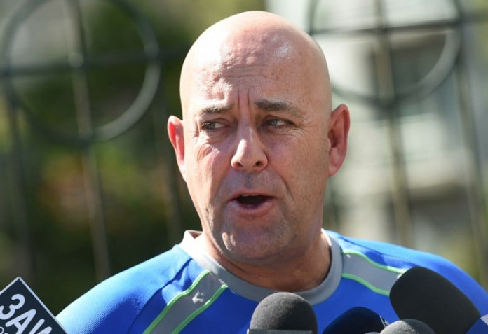 Australian cricket coach Darren Lehmann speaks to journalists in Melbourne on December 30, 2015, after Australia defeated the West Indies in the second Test match in four days. Lehmann said Australia were still weighing up selection options ahead of the final Test starting Sunday in Sydney, with bowler Peter Siddle notably carrying an ankle injury. / AFP / WILLIAM WEST