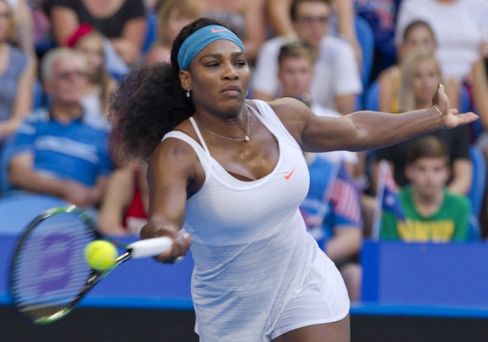 Serena Williams of the US hits a return against Jamila Wolfe of the Australia Gold team during their women's singles match on day three of the Hopman Cup tennis tournament in Perth on January 5, 2016. AFP PHOTO / Tony ASHBY