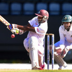 West Indies batsman Shivnarine Chanderpaul connects off a delivery from Bangladesh bowler Taijul Islam as wicket keeper Mushfiqir Rahim closes in on day three of the second and final Test between West Indies and Bangladesh on September 15, 2014 at the Beausejour Cricket Ground in Gros Islet, St Lucia. AFP PHOTO / Frederic J. BROWN / AFP / FREDERIC J. BROWN