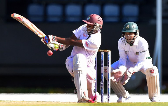 West Indies batsman Shivnarine Chanderpaul connects off a delivery from Bangladesh bowler Taijul Islam as wicket keeper Mushfiqir Rahim closes in on day three of the second and final Test between West Indies and Bangladesh on September 15, 2014 at the Beausejour Cricket Ground in Gros Islet, St Lucia. AFP PHOTO / Frederic J. BROWN / AFP / FREDERIC J. BROWN