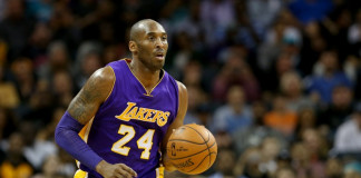 CHARLOTTE, NC - DECEMBER 28: Kobe Bryant #24 of the Los Angeles Lakers brings the ball up the court against the Charlotte Hornets at Time Warner Cable Arena on December 28, 2015 in Charlotte, North Carolina. NOTE TO USER: User expressly acknowledges and agrees that, by downloading and or using this photograph, User is consenting to the terms and conditions of the Getty Images License Agreement. Streeter Lecka/Getty Images/AFP