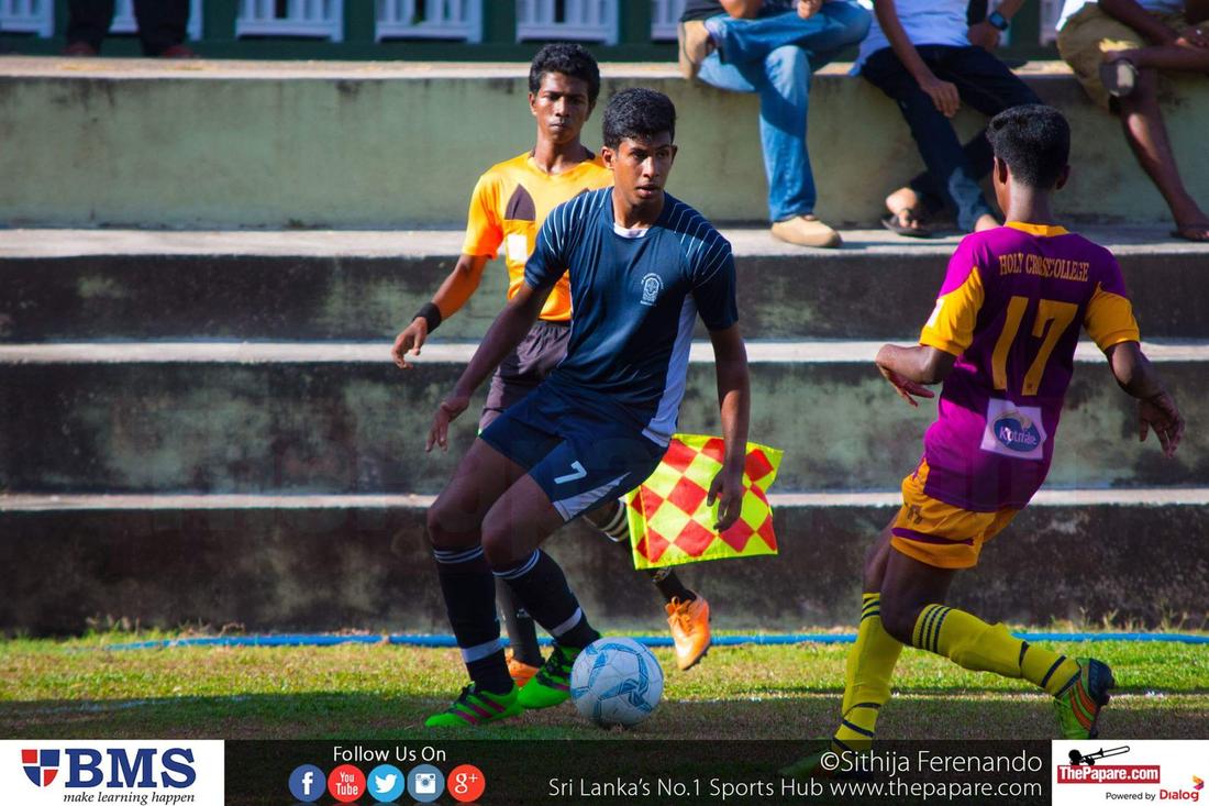 De Mazenod College v Holy Cross College - Schools Football 2016 - De Mazenod College, Kandana - 06/09/2016 Pramuditha Gunasekara (L) looking for an opening through Dinakara Rodrigo (R).