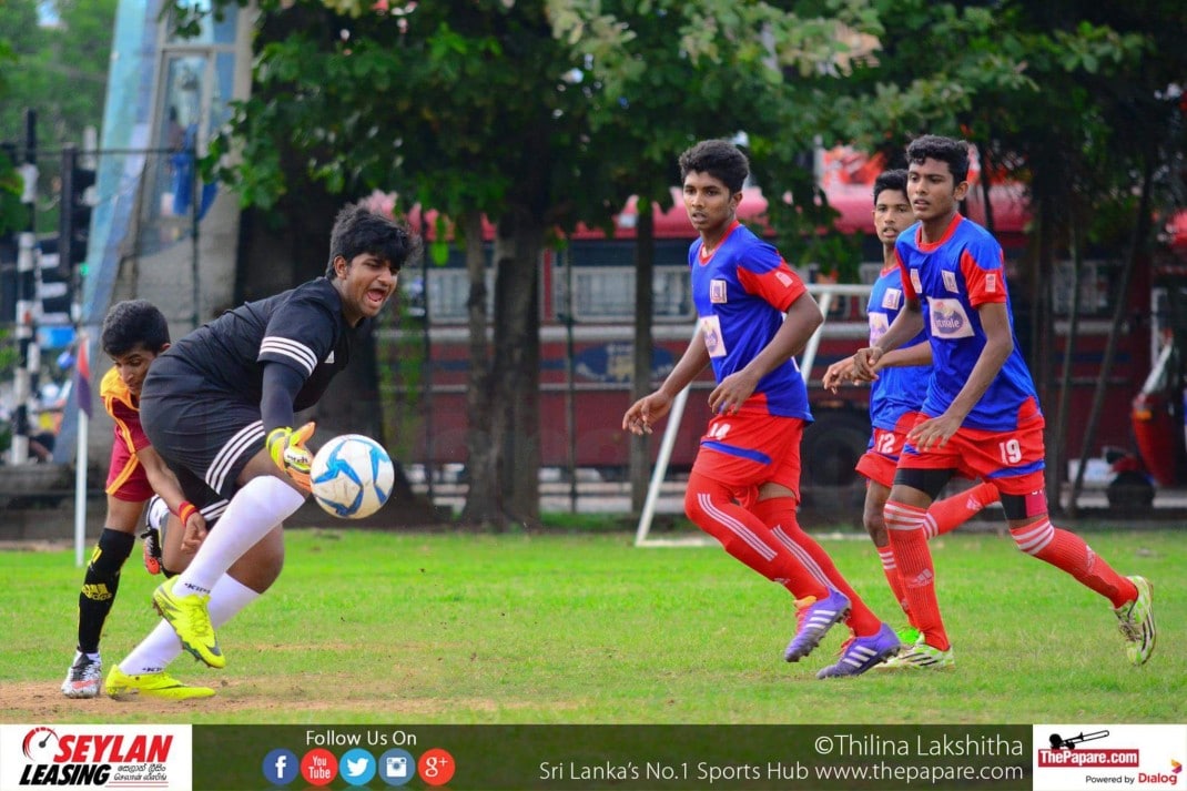 Maris Stella College v Wickramabahu College - U19 Schools Football Division I 2016 - Maris Stella Grounds, Negombo - 03/11/2016 The ball slips from Kanishka Silva's grasp as a Bahuwan striker barges into him.