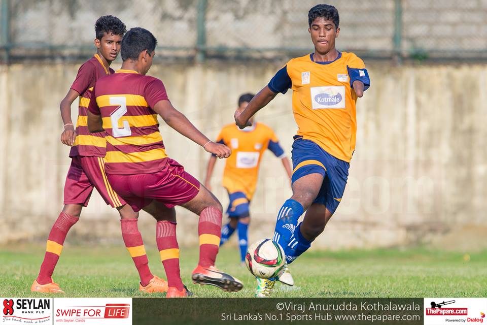Ananda College v St.Peter's College - U19 Division I - M.H.Mohamed Grounds - 02/12/2016 - Holding midfielder of St.Peter's College Niran Fernando (R) who was instrumental in the midfield in action