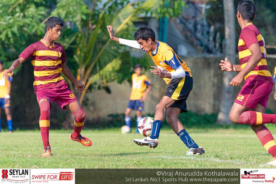 Ananda College v St.Peter's College - U19 Division I - M.H.Mohamed Grounds - 02/12/2016 - Jude Warren (M) who grabbed a brace for St.Peter's College trying to evade a defender