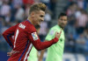 Griezmann double sends Atletico top
