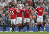 Win takes United top after Spurs crush City
