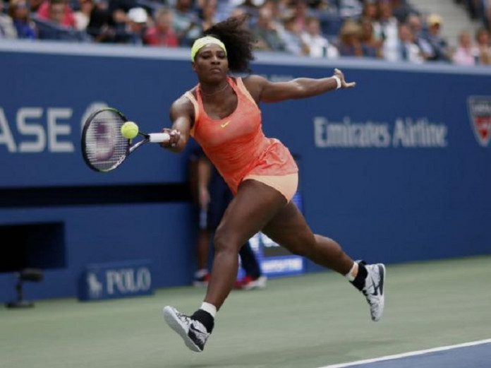 Williams of the U.S. returns volley to Vinci of Italy during their women's singles semi-final match at the U.S. Open Championships tennis tournament in New York
