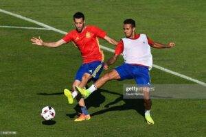 Sergio Busquets (L) 