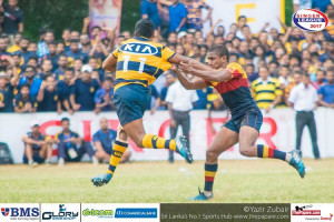 Sabith Feroze fends off Amith Kulathunga his opposite number