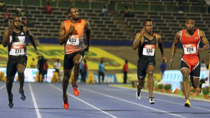 Bolt (second left) won his semi-final in 10.04 seconds