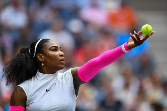 Serena Williams of the US serves to Yaroslava Shvedova of Kazakhstan during their US Open fourth round match,