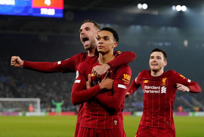 Premier League - Leicester City v Liverpool - King Power Stadium, Leicester, Britain - December 26, 2019 Liverpool's Trent Alexander-Arnold celebrates scoring their fourth goal with Jordan Henderson and Andrew Robertson REUTERS/Andrew Yates