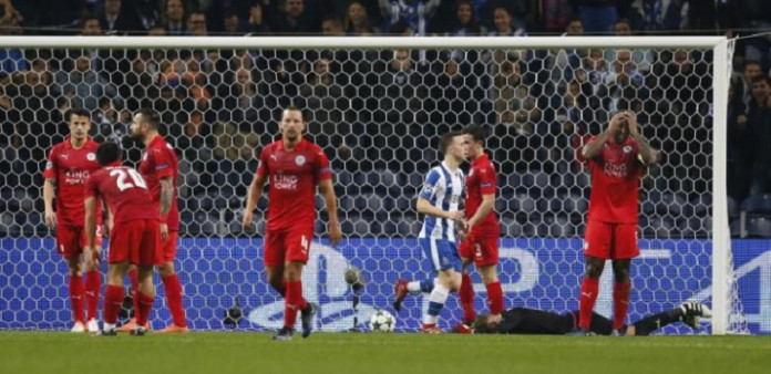 Leicester City's Wes Morgan and Ben Hamer look dejected after FC Porto's third goal