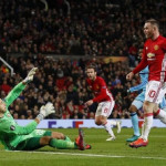 Manchester United's Wayne Rooney scores their first goal