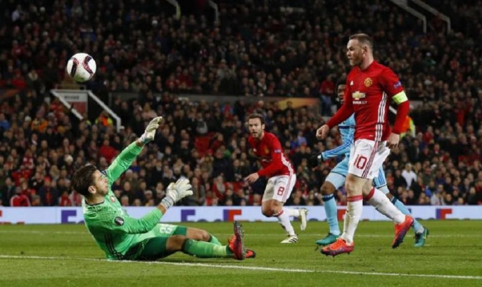 Manchester United's Wayne Rooney scores their first goal