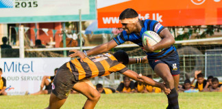 Mayon Jayawardena (R) trying to evade a tackle against D.S.Senanayake College