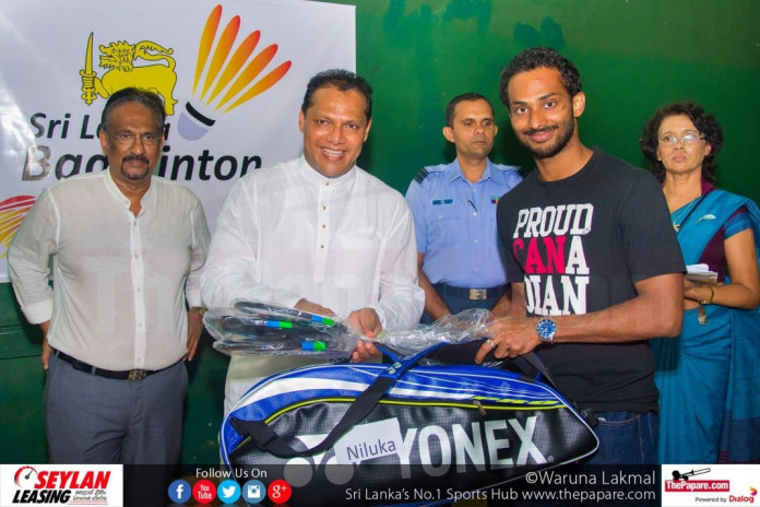 Niluka Karunaratne receiving his equipment from Dayasiri Cover photo