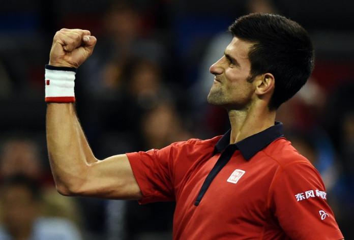 Novak Djokovic of Serbia celebrates after winning his men's singles semi-final match against Andy Murray