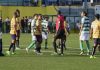 Referee shows green card in CONIFA World Football Cup match