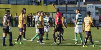 Referee shows green card in CONIFA World Football Cup match