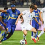 Sri Lanka’s Chamod Dilshan (L) & Uzbekistan’s captain Eldor Shomurodov (R) tussling for the ball in their AFC Asian Cup qualifiers 2023 – 3rd Round match