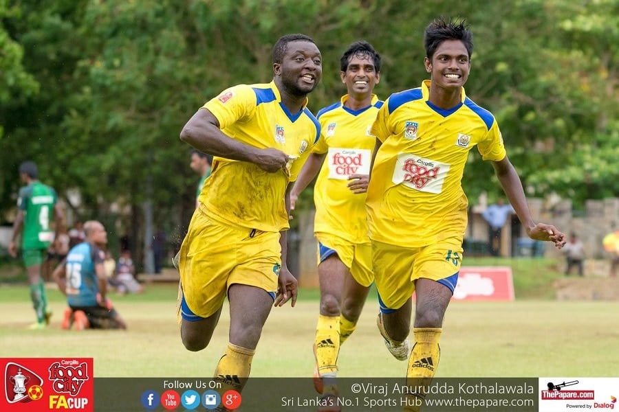 Saunders SC's Abdul Mohamed (L) celebrates scoring a goal with his teammates - FA Cup 2016 Quarter Finals