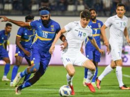 Sri Lanka’s Chamod Dilshan (L) & Uzbekistan’s captain Eldor Shomurodov (R) tussling for the ball in their AFC Asian Cup qualifiers 2023 – 3rd Round match