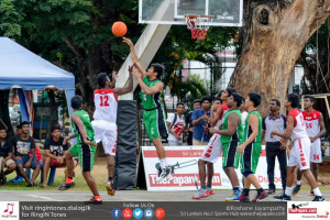 Taher Akbarally (06) blocking off Nipun Fernando`s (12) shot