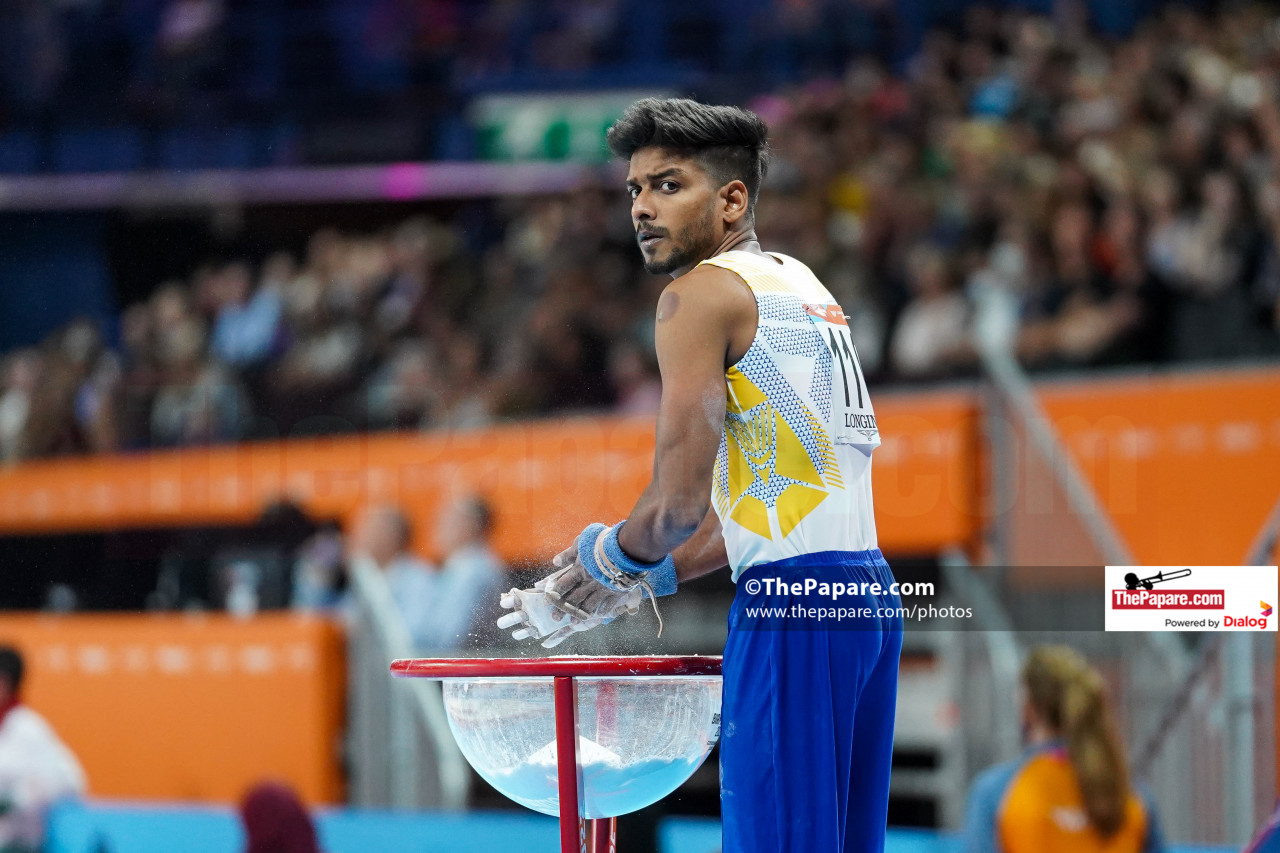 Ruchira Fernando prepares to complete his routine on the Parallel Bars at the Arena Birmingham during the Birmingham 2022 Commonwealth Games.