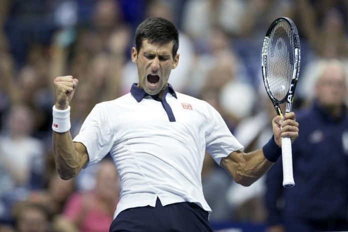 Djokovic of Serbia celebrates winning a game during his fourth round match against Agut of Spain at the U.S. Open Championships tennis tournament in New York