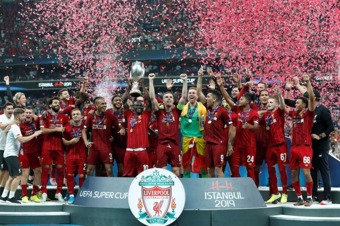 Liverpool's Sadio Mane lifts the trophy as he celebrates winning the UEFA Super Cup with team mates