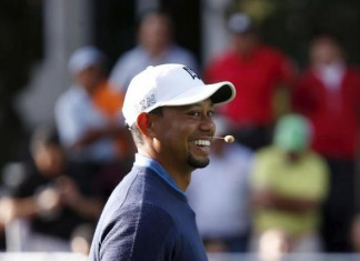 U.S. golfer Tiger Woods smiles during a golf clinic in Mexico City October 20, 2015. REUTERS/Edgard Garrido