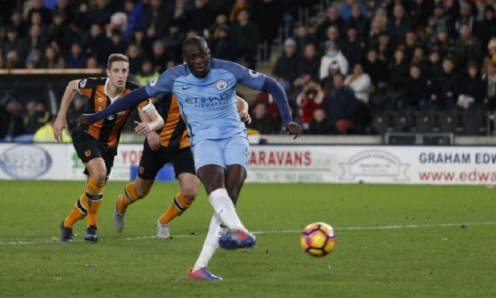Manchester City's Yaya Toure scores their first goal from the penalty spot