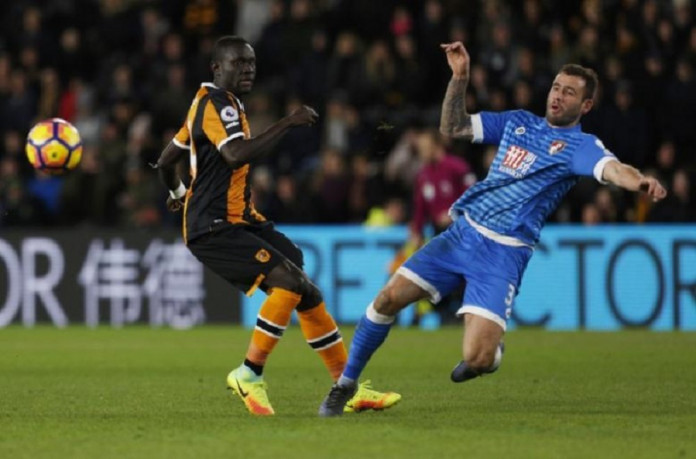 Bournemouth's Steve Cook in action with Hull City's Oumar Niasse