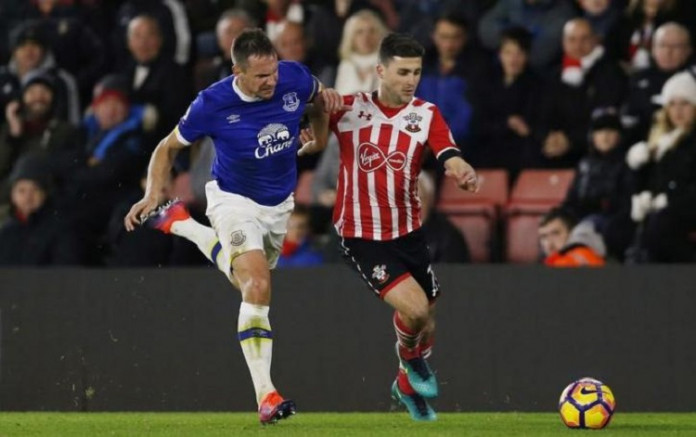 Everton's Phil Jagielka and Southampton's Shane Long in action