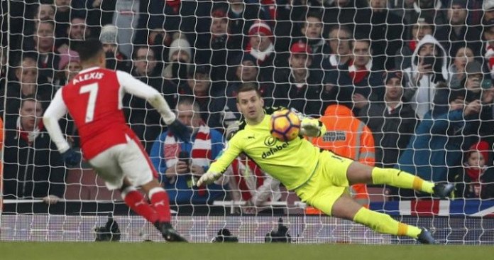 Arsenal's Alexis Sanchez scores their second goal from the penalty spot