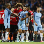 Manchester United's Marouane Fellaini with Manchester City's Sergio Aguero after being sent off by referee Martin Atkinson
