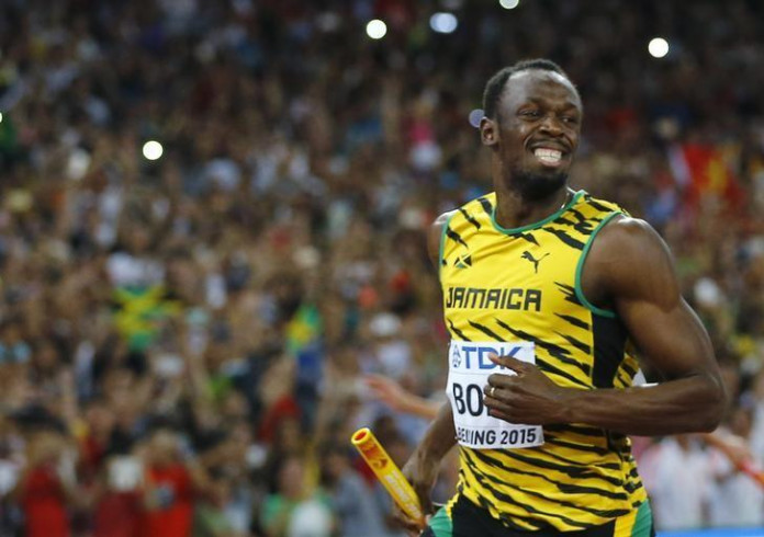 Usain Bolt of Jamaica smiles after running the anchor leg to win the men's 4 x 100 metres relay final at the 15th IAAF Championships at the National Stadium in Beijing, China August 29, 2015. REUTERS/Kai Pfaffenbach